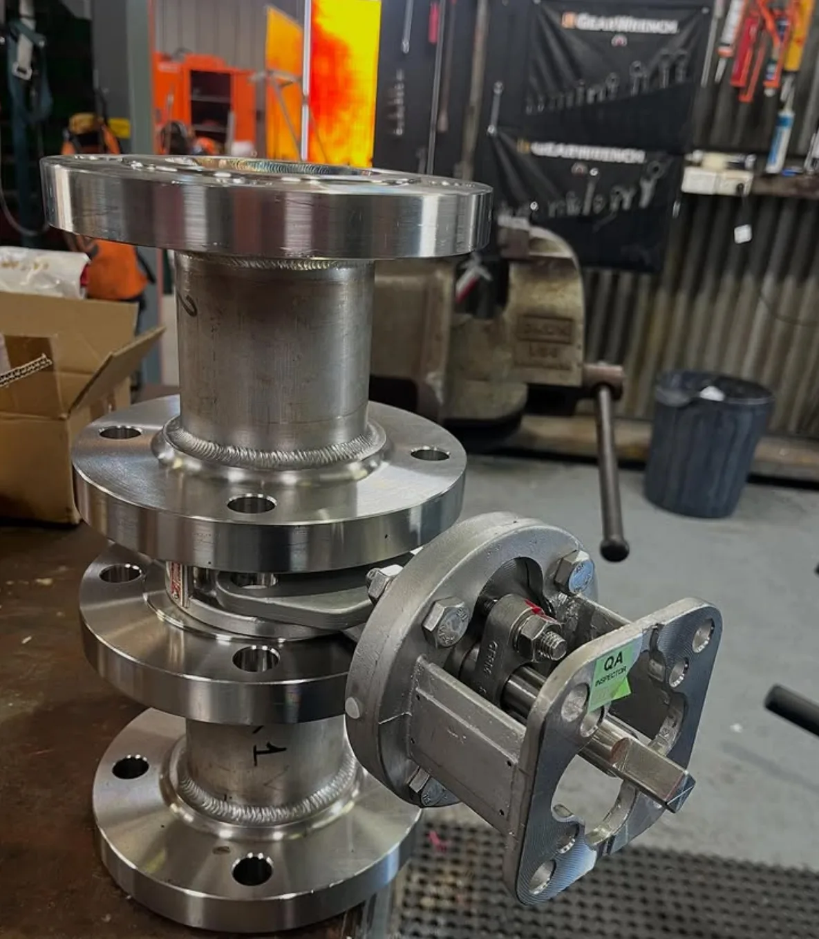 Stainless spools and a valve on the bench